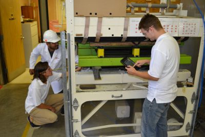 Image 5. Page and the other 2013 interns working on a project in the pallet lab.