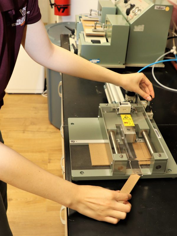 New sample cutter being used Photo 2. Showing the smaller, highly-precise, rectangular samples needed for ECT testing.