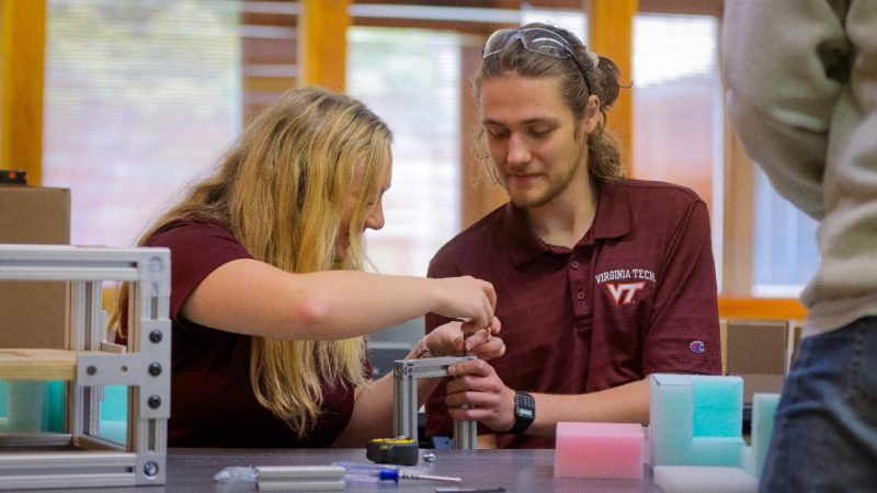 Image 1. Undergraduate students creating frames to hold the decoy packages’ sensors.