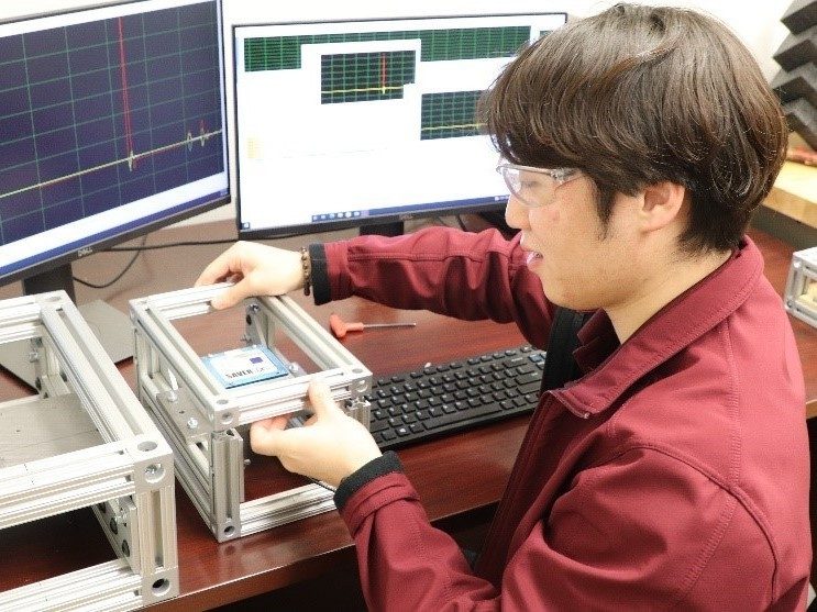Image 2. Saewhan creating decoy boxes with sensors. 	