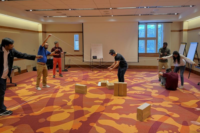 Image 3. CPULD team working to silently guide blindfolded team-members thru tasks.
