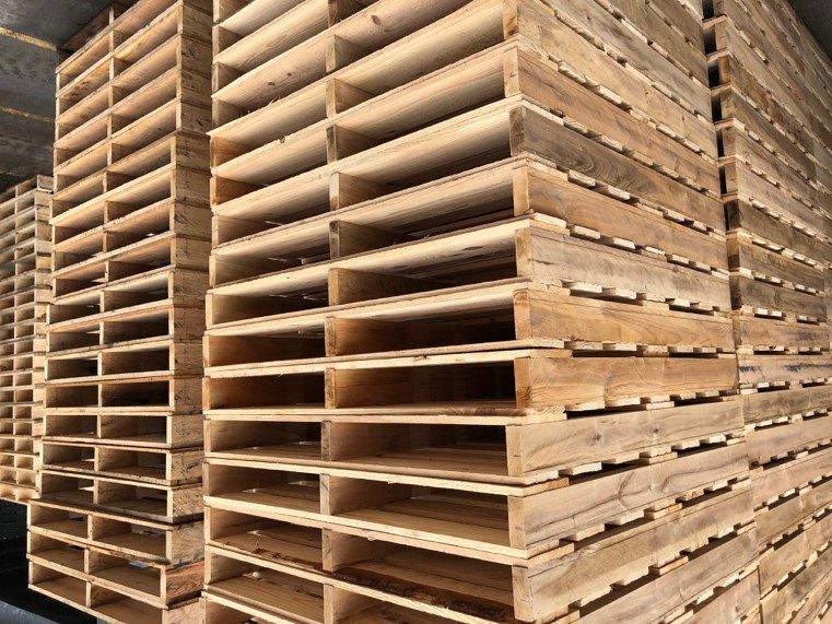 Stacks of wooden pallets to be reused and/or recycled.